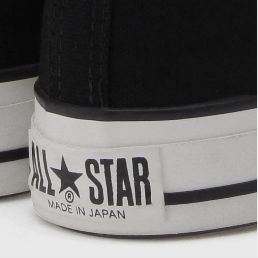 Black and white high-top canvas shoes