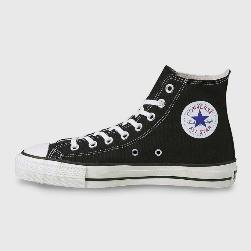 Black and white high-top canvas shoes