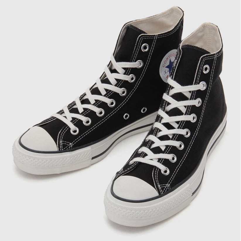 Black and white high-top canvas shoes