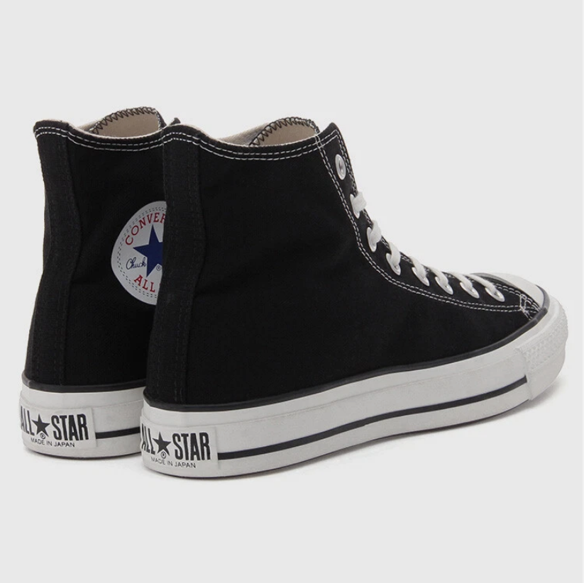 Black and white high-top canvas shoes