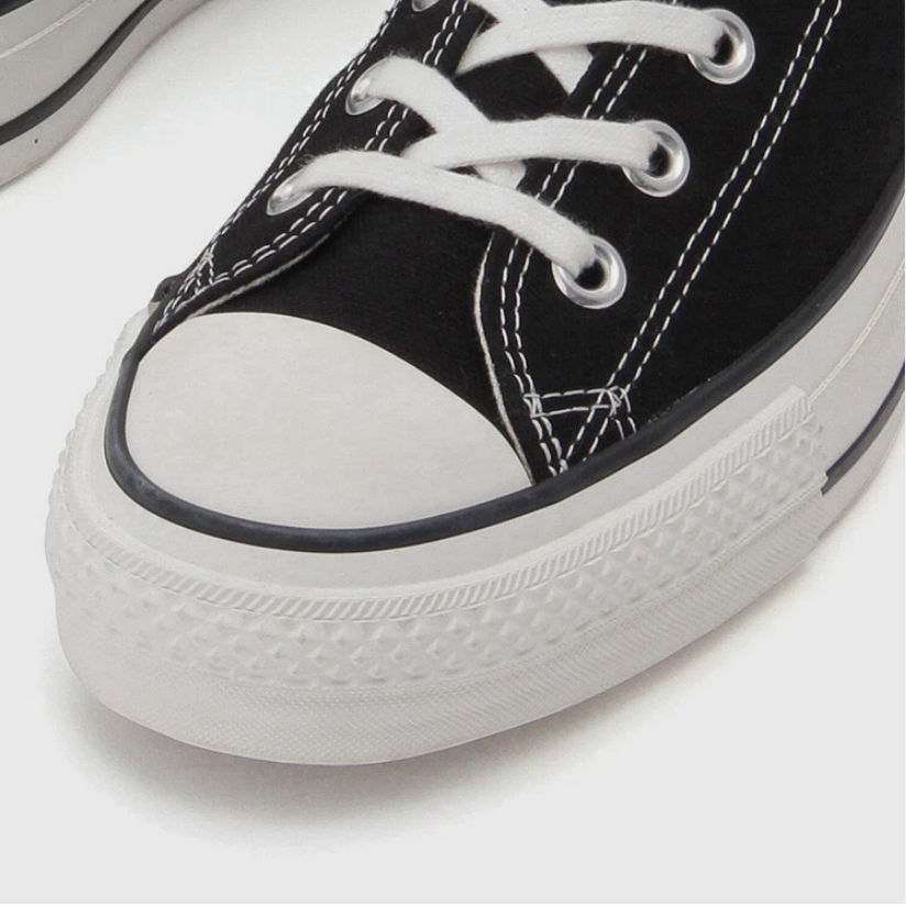 Black and white high-top canvas shoes